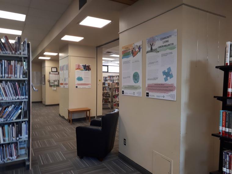 Photo of five posters displayed on walls at the Public Library.