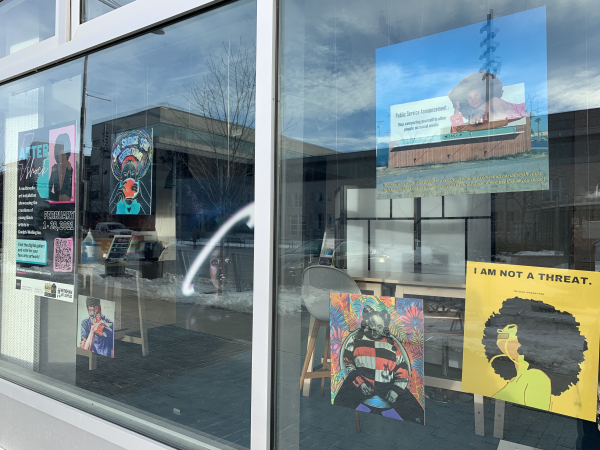 This is a picture of Aftershock's art work in the window of 10C. 