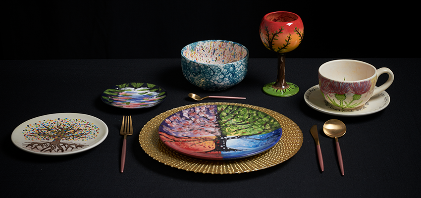 a display of painted ceramic plates and bowls
